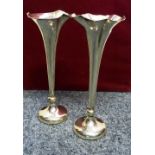 A silver pair of vases, Birmingham 1910, of tapering form, loaded, 21cm