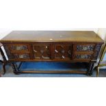 Early 20th century Jacobean style oak barley twist sideboard, with panelled doors and carved