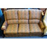 Modern red and blue patterned six cushion three-seater settee