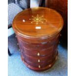 Eastern brass inlaid hardwood drum table, with lift top and twelve drawers in four banks of three