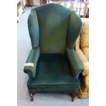 Dark blue upholstered high-back wing armchair, with cabriole front legs