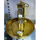 A brass safety lamp by Eccles, type 6, 23cm high together with two brass circular trays