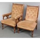 An Edwardian carved walnut armchair upholstered in mushroom coloured Dralon, raised on turned