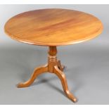 A Victorian mahogany snap top tea table, raised on a turned column and tripod base 27"h x 34"