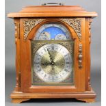 Emperor, a reproduction Georgian style chiming bracket clock, the gilt arched dial with phases of