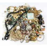 A quantity of costume jewellery and watches including a silver compact