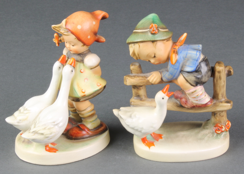 A Hummel figure of a boy and goose 1932/0 4", a ditto of a girl with geese 473/0 4"