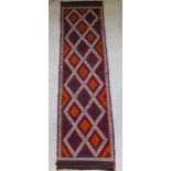 A contemporary Kelim runner with oval geometric design 107" x 28"