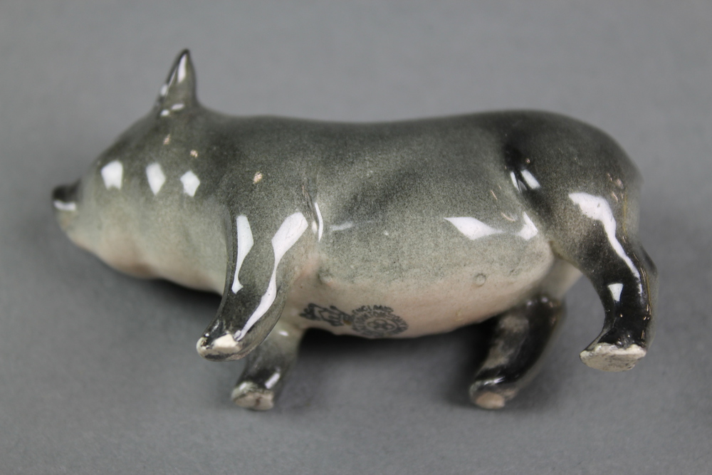 A Royal Doulton figure of a Vietnamese pot bellied pig 6 1/2", a ditto of a piglet 2 1/2" The piglet - Image 2 of 2