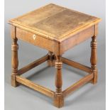 An oak joined stool with hinged lid, raised on turned and block supports 16"h x 14 1/2" x 14" The