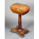 A Regency mahogany teapoy of sarcophagus form, raised on turned column with triform base, (no