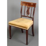 A 19th Century mahogany bar back chair with lyre shaped splat back and over stuffed seat, raised