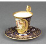 A 19th Century Austrian cabinet cup and saucer, the blue and gilt ground with a panel of Diana