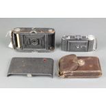 An Agfa Billy Compur 9 x 5 folding camera and a Kodak NO.3 automatic folding camera