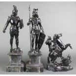 A pair of 19th Century black painted spelter figures of standing warriors raised on marble bases