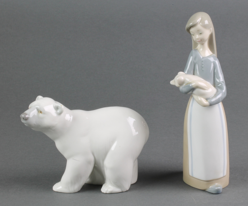 A Lladro figure of a standing polar bear A14M 4" and a ditto of a girl with piglets 6 1/2"