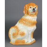 A Victorian Staffordshire figure of a Spaniel with glass eyes