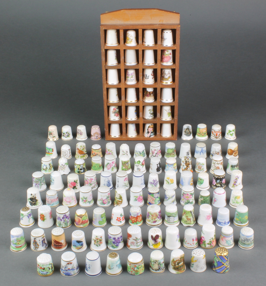 A collection of modern porcelain and china thimbles including Aynsley etc