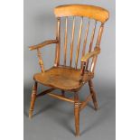 A 19th Century light elm Windsor stick and rail back chair with H framed stretcher, raised on turned