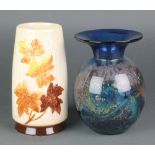 A Sylvac leaf vase of tapered form 8" and a studio blue glass vase 7 1/2" The first item has a