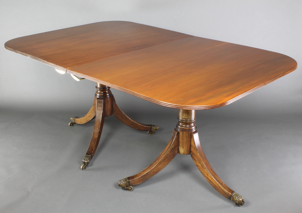 A Georgian style mahogany twin pillar D end extending dining table with 1 extra leaf, 29 1/2"h x