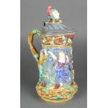 A 19th Century Minton Majolica jug with revelling scene and pewter mounts and impressed marks 12"