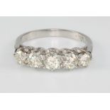 An 18ct white white gold 5 stone diamond ring, approx 1.25ct, size L 1/2