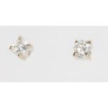 A pair of white gold diamond ear studs, each approx. 0.10ct