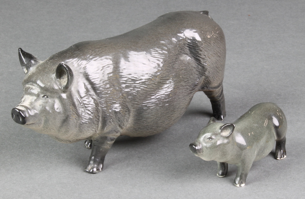 A Royal Doulton figure of a Vietnamese pot bellied pig 6 1/2", a ditto of a piglet 2 1/2" The piglet