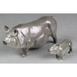 A Royal Doulton figure of a Vietnamese pot bellied pig 6 1/2", a ditto of a piglet 2 1/2" The piglet