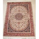 A contemporary Belgian cotton Kashan style white ground carpet with central medallion 76" x 55 1/2"