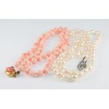 A coral necklace 18" and a cultured pearl ditto 18"