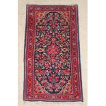 A red and blue ground Persian Sarough rug with floral ground 51" x 27"