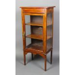 An Edwardian inlaid mahogany display cabinet, the interior fitted a shelf enclosed by glazed