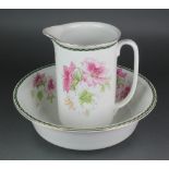 A Edwardian wash stand jug and basin decorated with flowers