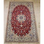 A white, brown and floral ground Main carpet with central medallion 101" x 61"