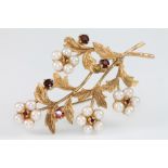 A 9ct pearl and garnet floral spray brooch, gross 10 grams