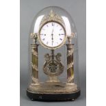 A Victorian 8 day chiming mantel clock with enamelled dial and Roman numerals supported by 2 columns