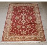 A contemporary Belgian cotton red and gold ground Heriz style rug 88" x 79"