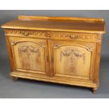 A 19th Century carved walnut side cabinet with raised back, fitted 2 long drawers above a double