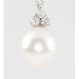 A pearl pendant with diamond set mount on an 18ct white gold chain