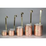 A set of 5 graduated Continental copper and brass milk measures 1L, 0.75l, 0.50l, 0.25l, 0.10l