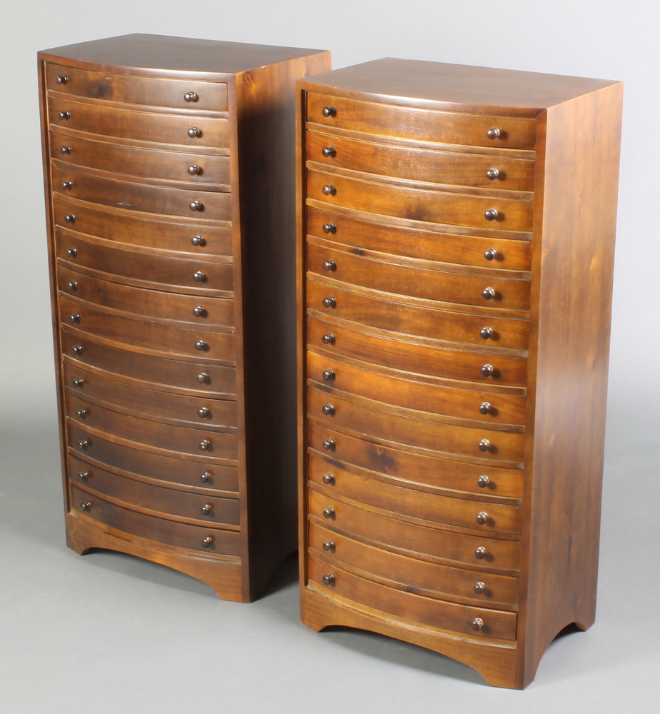 A pair of Victorian style mahogany bow front chests of 14 shallow drawers, raised on bracket feet 36