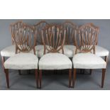 A set of 6 and 1 very similar 19th century Hepplewhite style shield back carved dining chairs with