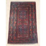 A contemporary brown and blue ground Belouche rug 55" x 34"