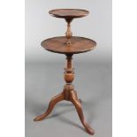 A Georgian style mahogany circular 2 tier dumb waiter 30"h, the top tier 10"diam, bottom tier 14"