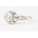 An 18ct white gold single stone diamond ring, the centre stone 0.76ct surrounded by brilliant cut