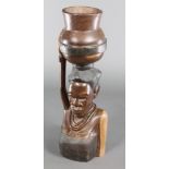 An African carved jardiniere in the form of a lady with bowl and child, marked By B Silumpa 28"h