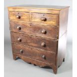 A 19th Century mahogany chest of 2 short and 3 long drawers with tore handles and brass escutcheons,