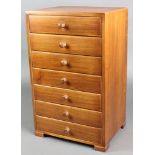 A rectangular mahogany table top chest of 7 long drawers with tore handles, raised on bracket feet